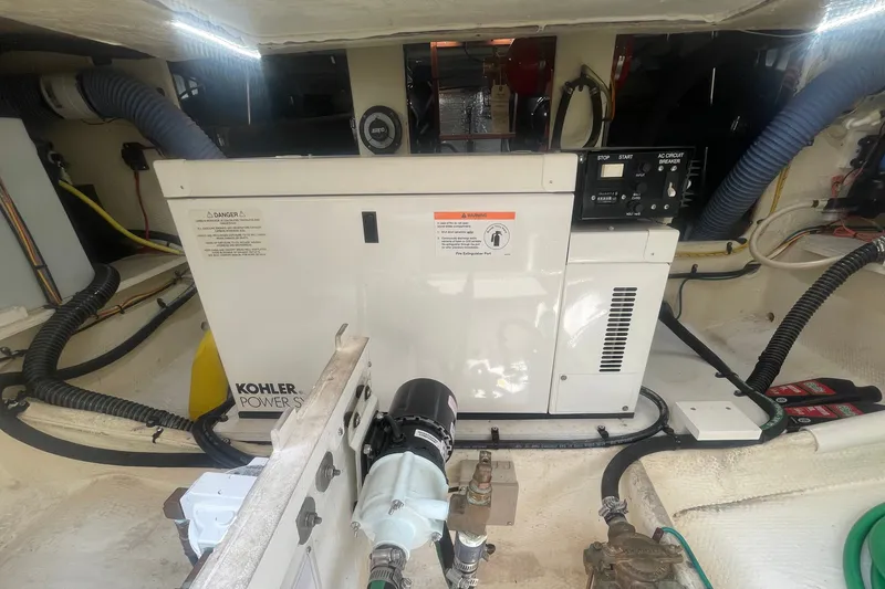 Slide: The Image of Engine room of 2006 Silverton 34 Convertible with Kohler power system. - 69