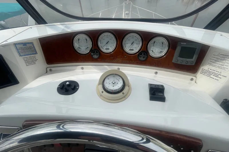 Slide: The Image of Helm of 2006 Silverton 34 Convertible with gauges and controls. - 38