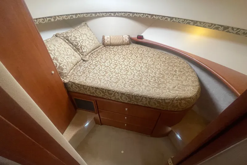 Slide: The Image of Luxurious cabin interior of 2006 Silverton 34 Convertible yacht with patterned bedding. - 59