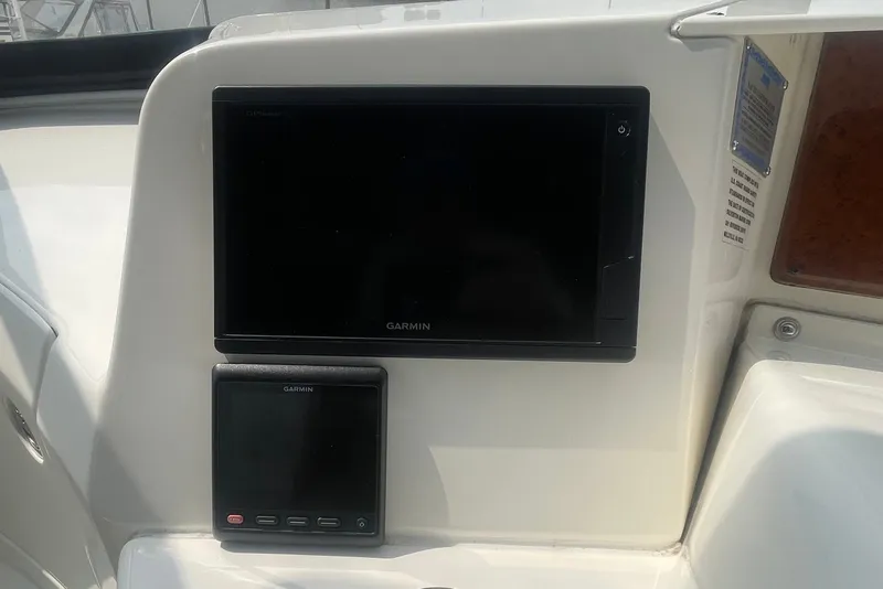 Slide: The Image of Garmin navigation screens on 2006 Silverton 34 Convertible boat dashboard. - 39