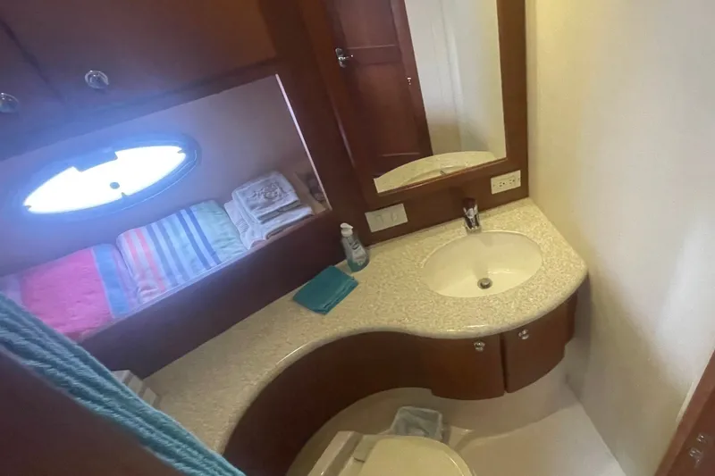 Slide: The Image of Bathroom interior of 2006 Silverton 34 Convertible yacht with sink and mirror. - 61