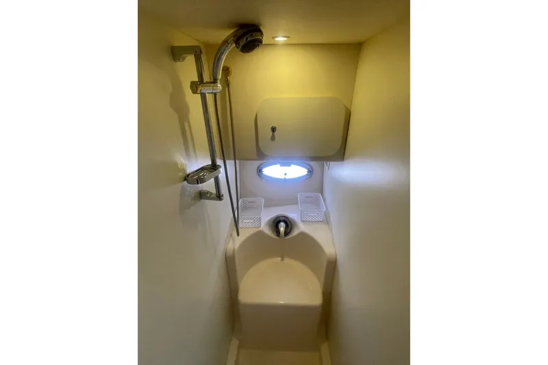 Slide: The Image of Compact bathroom with shower in 2006 Silverton 34 Convertible boat. - 62