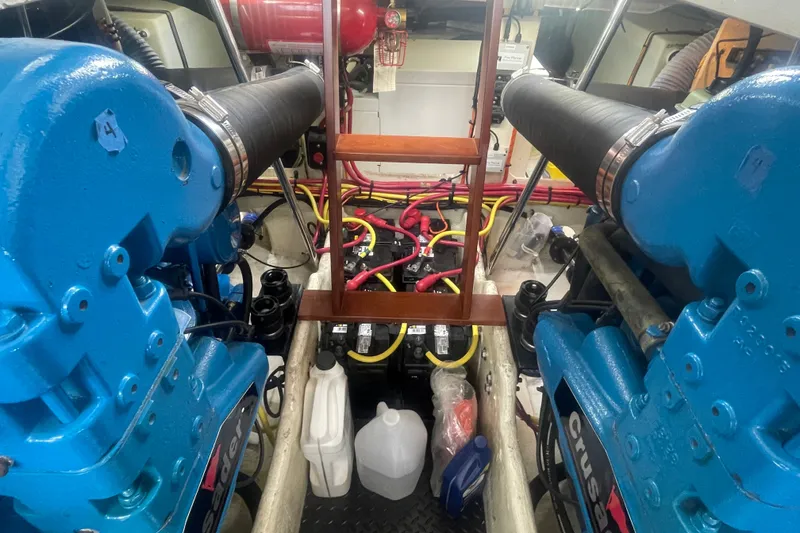 Slide: The Image of Engine room of 2006 Silverton 34 Convertible with blue machinery and wiring. - 65