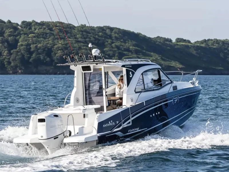 The Image of Manufacturer Provided Image: 2026 Beneteau Antares 7 cruising on the water with scenic forested background. - 0