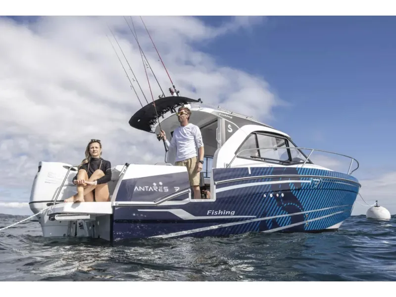 Slide: The Image of Manufacturer Provided Image: 2026 Beneteau Antares 7 Fishing boat on water with two people onboard, fishing rods visible. - 1