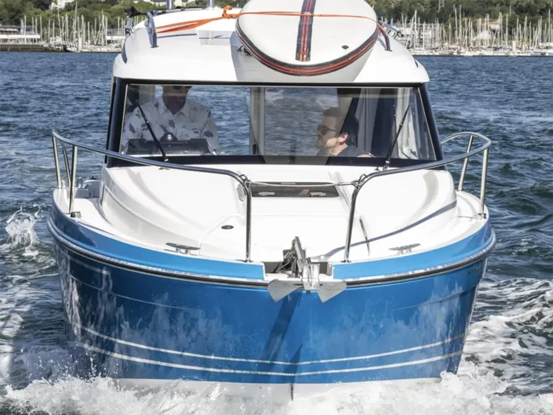 Slide: The Image of Manufacturer Provided Image: 2026 Beneteau Antares 7 Fishing boat cruising on water, front view. - 2