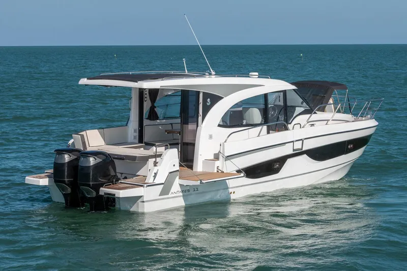 The Image of Manufacturer Provided Image: 2026 Beneteau Antares 11 Coupe cruising on open water, rear view. - 1