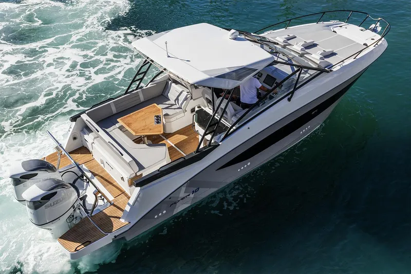 Slide: The Image of Manufacturer Provided Image: 2026 Beneteau Flyer 10 cruising on water, featuring sleek design and powerful dual engines. - 1