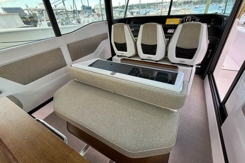 Slide: The Image of Interior of 2023 Axopar 45 XC Cross Cabin with modern seating and sleek design. - 20