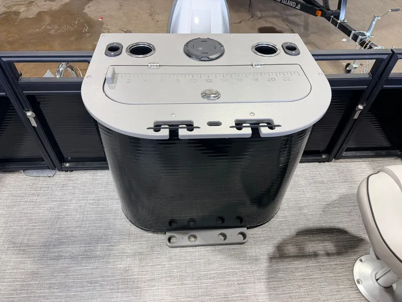 Slide: The Image of A fishing boat with a fish measuring board and cup holders on the deck. - 46