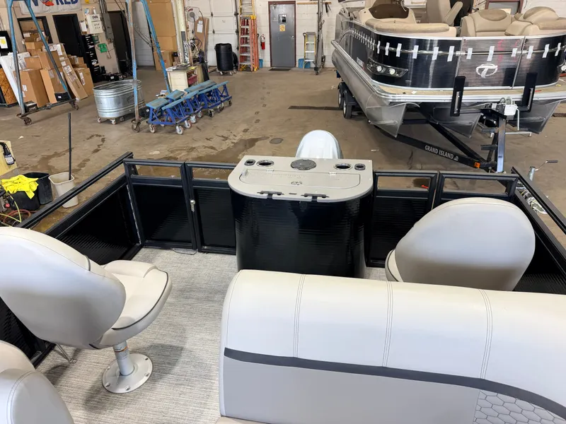 Slide: The Image of Interior of a modern pontoon boat with comfortable seating and a helm console in a workshop. - 8
