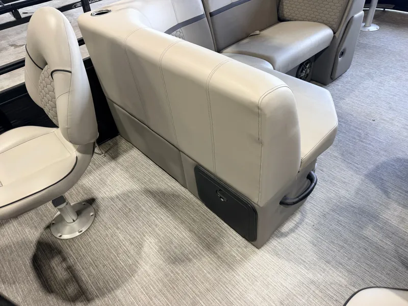 Slide: The Image of Interior of a boat with beige upholstered seats and carpeted flooring. - 44