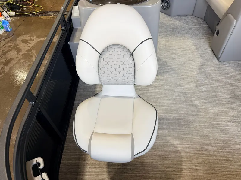 Slide: The Image of A sleek, cushioned seat with a honeycomb pattern on a boat. - 16