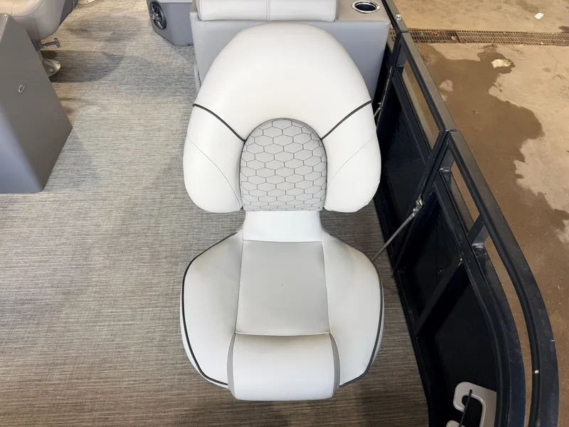 Slide: The Image of A sleek, cushioned seat with a honeycomb pattern on a boat. - 11