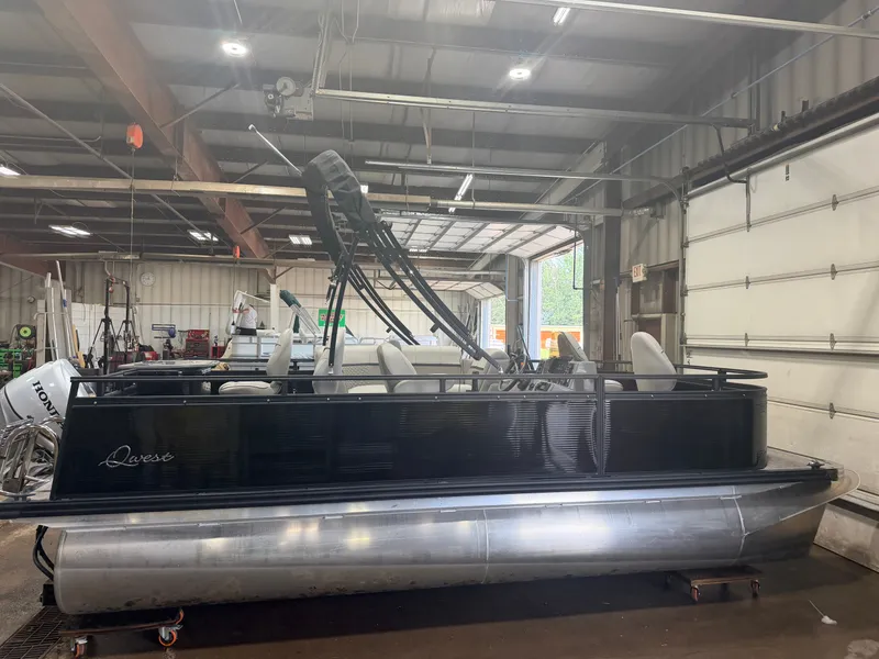 Slide: The Image of A 2023 Apex Marine Qwest L818 Fish pontoon boat with a 60HP Honda 4-stroke engine in a warehouse. - 19