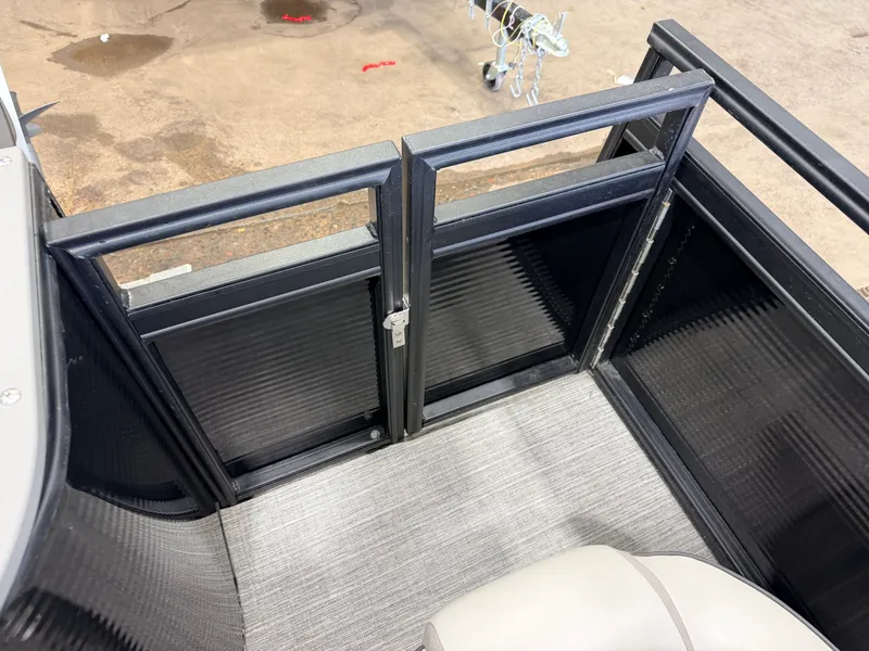 Slide: The Image of The image shows the interior of a boat with gray carpeting and black railings. - 42