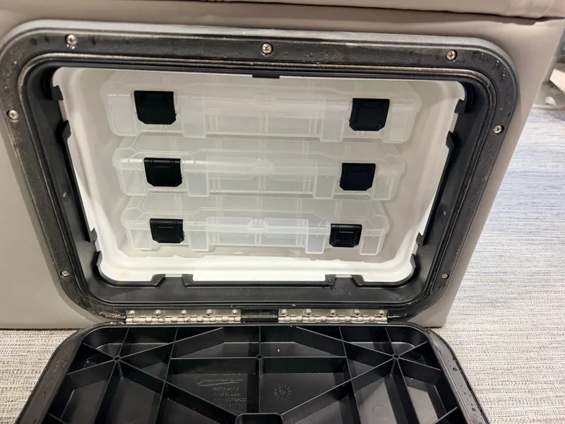 Slide: The Image of An open storage compartment with several transparent plastic containers inside. - 45
