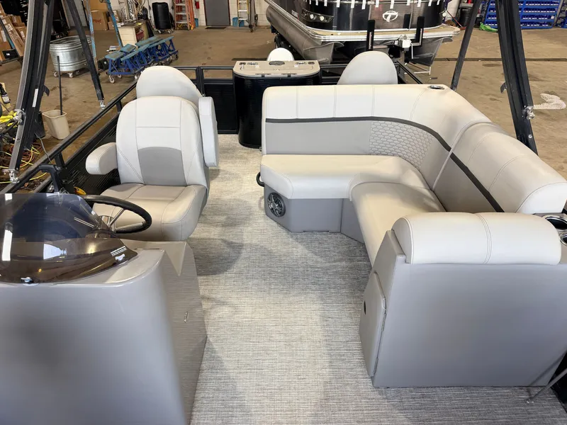 Slide: The Image of Interior of a modern pontoon boat with gray upholstery and a helm station. - 4