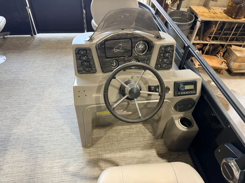 Slide: The Image of The image shows a boat's helm with a steering wheel and various instruments. - 23