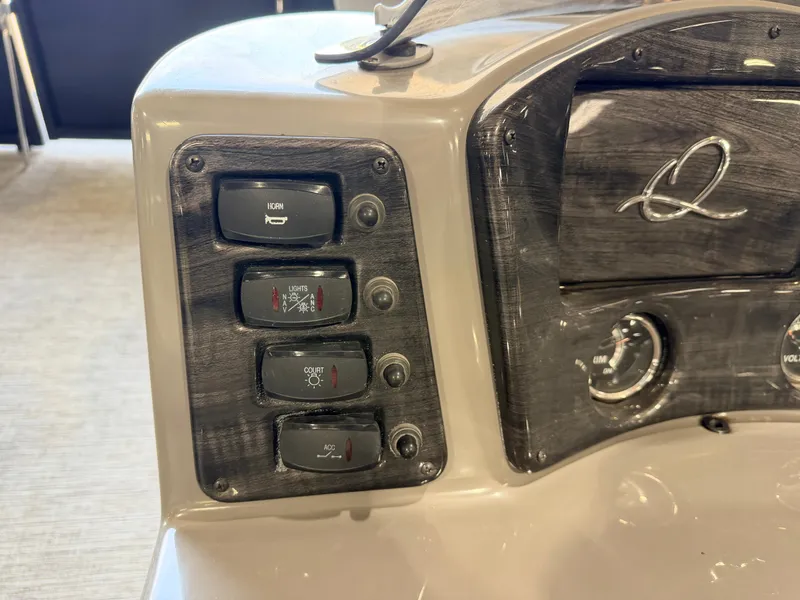 Slide: The Image of Close-up of a boat's helm with switches and a tachometer. - 25