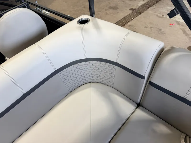 Slide: The Image of The image shows an elegant, cream-colored boat seat with gray accents and a cup holder. - 36