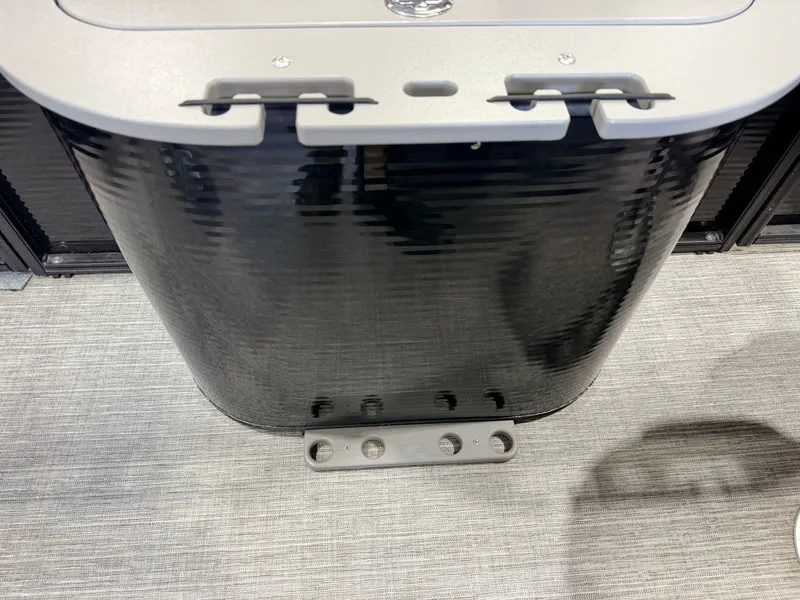 Slide: The Image of Close-up of a boat detail with a shiny, ribbed surface and a gray mounting bracket. - 50