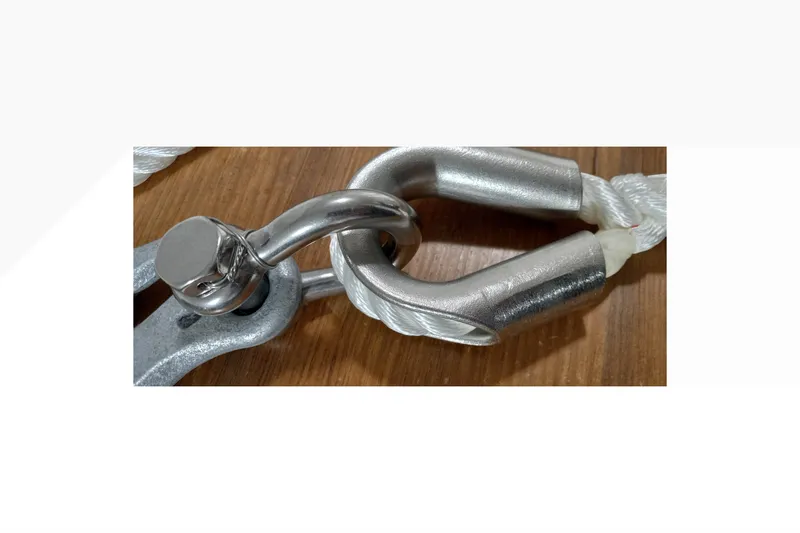 Slide: The Image of Close-up of a metal shackle and rope on a Pacific Seacraft Dana 24, 2002 model. - 16