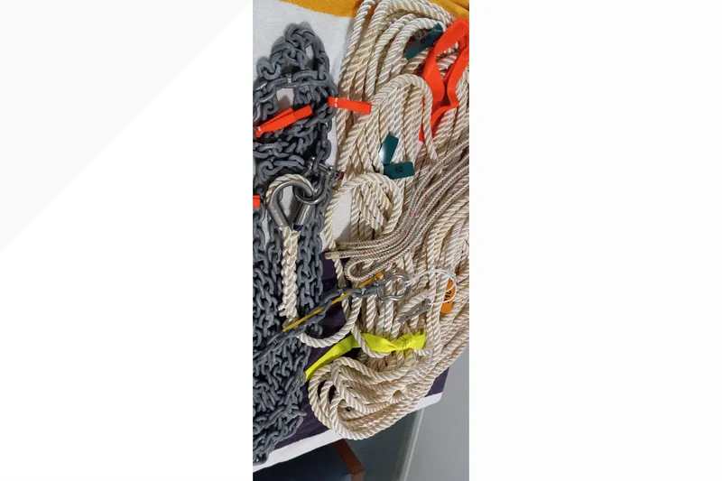 Slide: The Image of Ropes and chains on a 2002 Pacific Seacraft Dana 24 sailboat. - 57