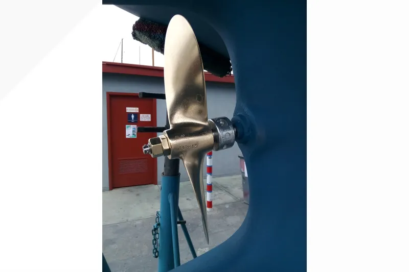 Slide: The Image of Close-up of a 2002 Pacific Seacraft Dana 24 boat propeller in a shipyard. - 28