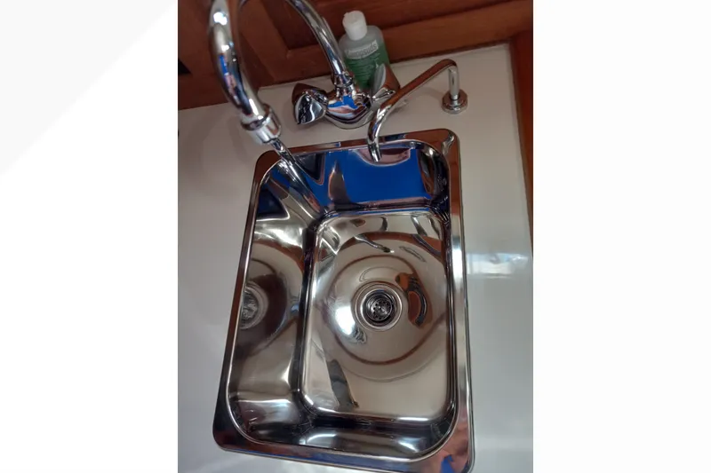 Slide: The Image of Stainless steel sink in 2002 Pacific Seacraft Dana 24 yacht galley. - 49