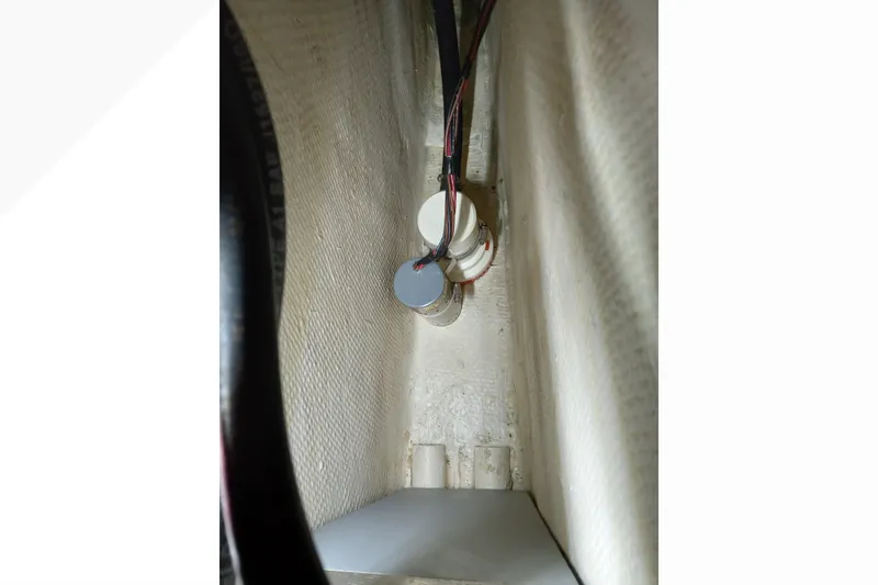 Slide: The Image of Interior view of a 2002 Pacific Seacraft Dana 24 sailboat, showing wiring and components. - 25