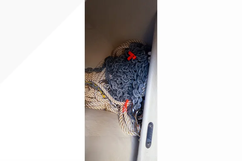 Slide: The Image of Anchor chain and rope storage on 2002 Pacific Seacraft Dana 24 sailboat. - 54