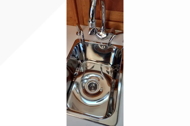 Slide: The Image of Stainless steel sink in 2002 Pacific Seacraft Dana 24 yacht galley. - 56