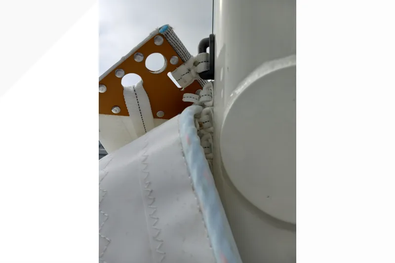 Slide: The Image of Close-up of Pacific Seacraft Dana 24 sailboat rigging, showcasing detailed stitching and hardware. - 41