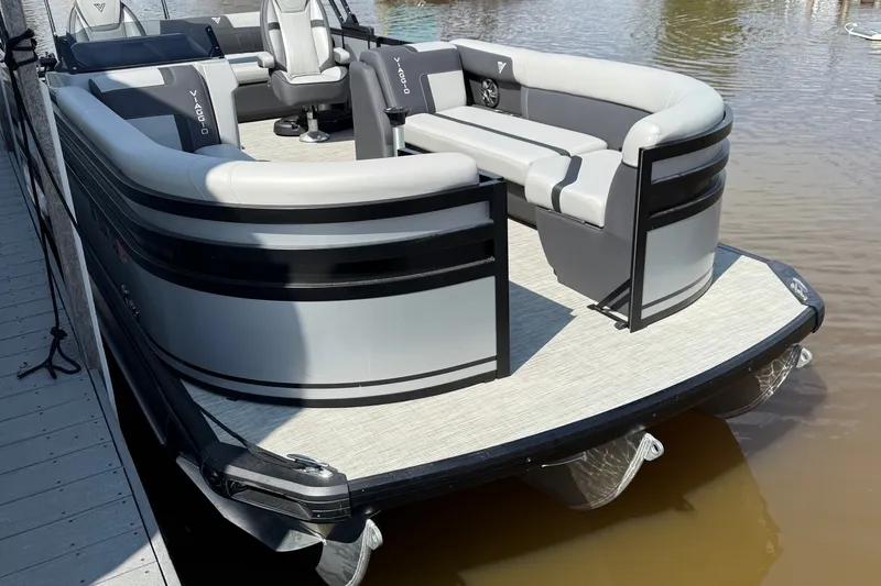 Slide: The Image of Luxury Viaggio X24 pontoon boat, 2026 model, docked on calm water. - 3