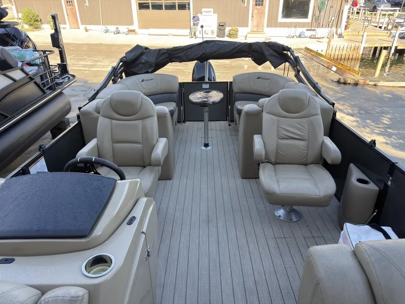 Slide: The Image of The image shows the interior of a 2019 Starcraft SLS 3 boat with beige leather seats. - 22