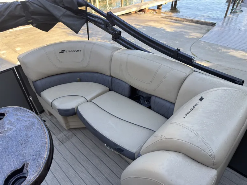 Slide: The Image of The image shows the seating area of a 2019 Starcraft SLS 3 with cream-colored upholstery. - 16
