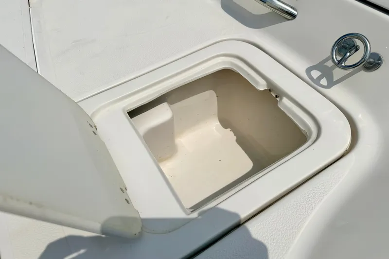 Slide: The Image of Open storage compartment on a 2005 Starcraft 2100 IO RE Limited boat. - 24