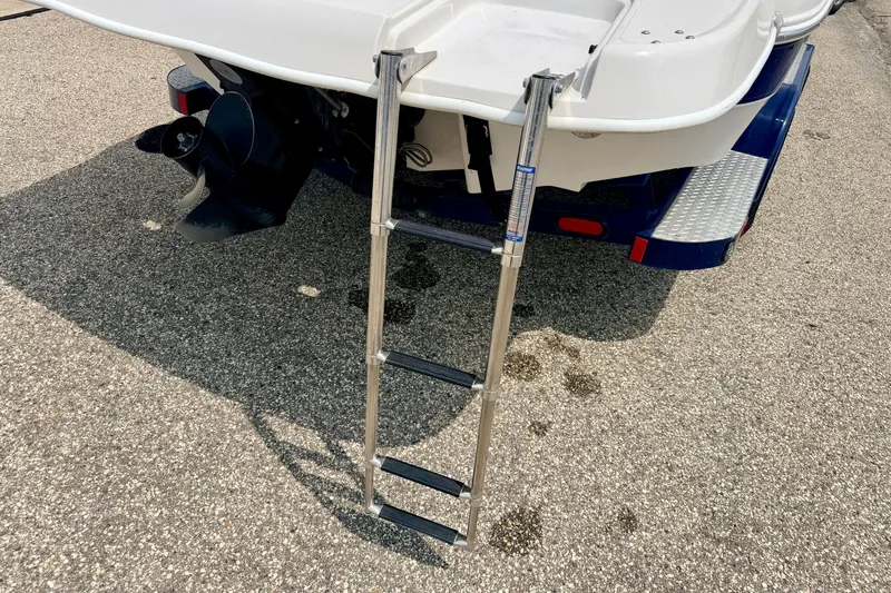 Slide: The Image of Rear view of 2005 Starcraft 2100 IO RE Limited boat with ladder and propeller. - 22