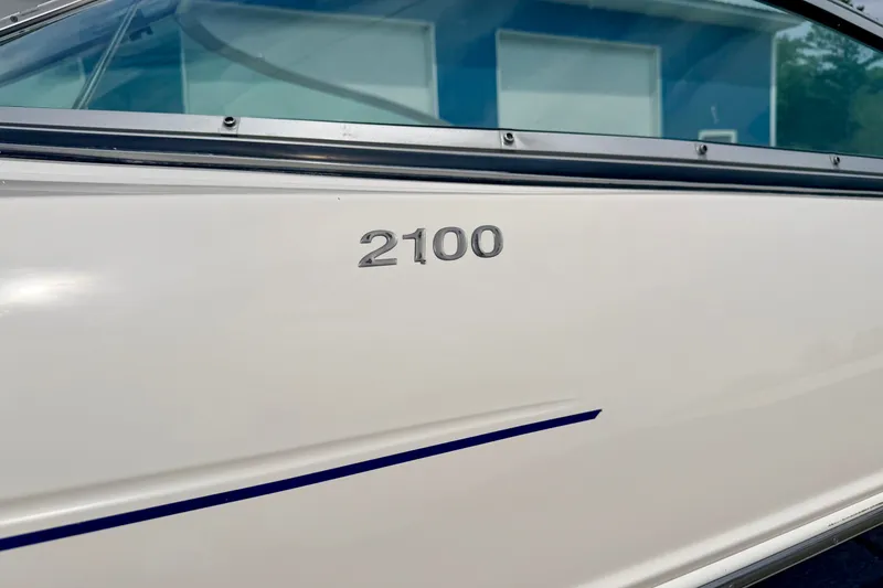 Slide: The Image of 2005 Starcraft 2100 IO RE Limited boat exterior with model number displayed. - 8
