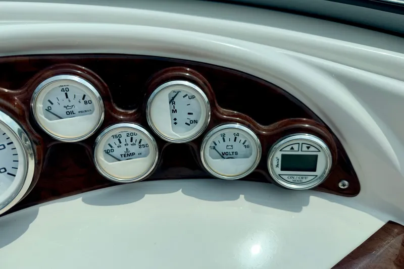 Slide: The Image of Dashboard gauges of a 2005 Starcraft 2100 IO RE Limited boat. - 45
