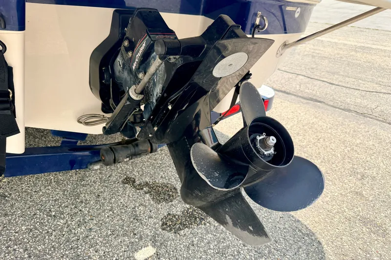 Slide: The Image of Rear view of a 2005 Starcraft 2100 IO RE Limited boat propeller and motor. - 20