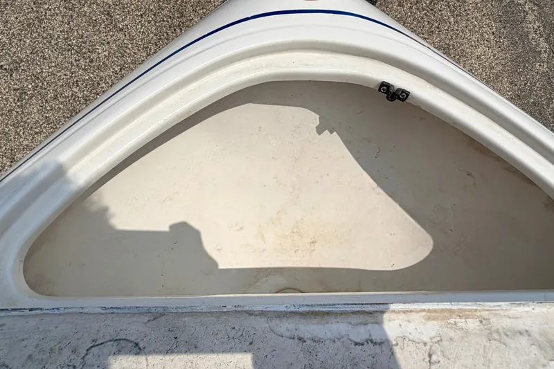Slide: The Image of Open storage compartment of a 2005 Starcraft 2100 IO RE Limited boat. - 68