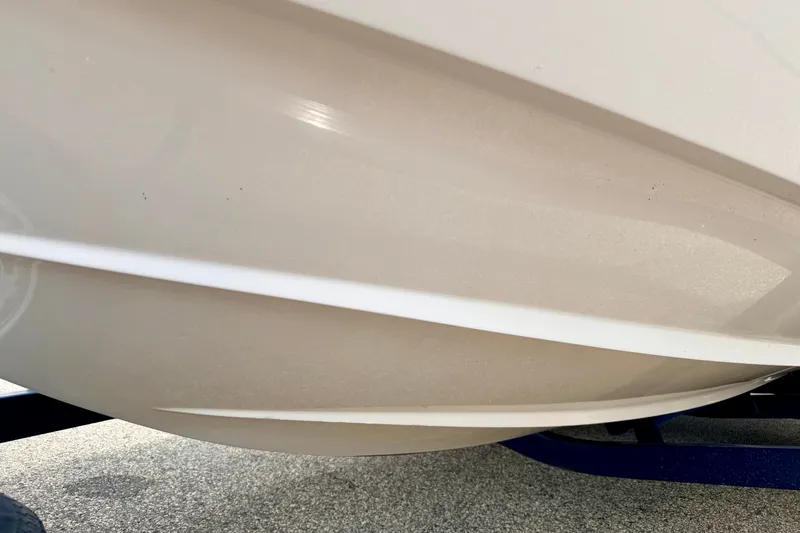 Slide: The Image of Close-up of 2005 Starcraft 2100 IO RE Limited boat hull on trailer. - 80