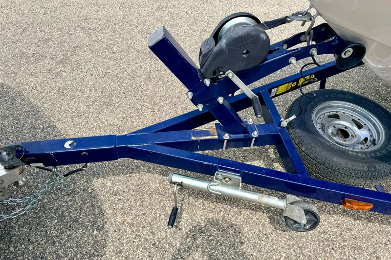 Slide: The Image of Trailer hitch and wheel assembly of a 2005 Starcraft 2100 IO RE Limited boat. - 75