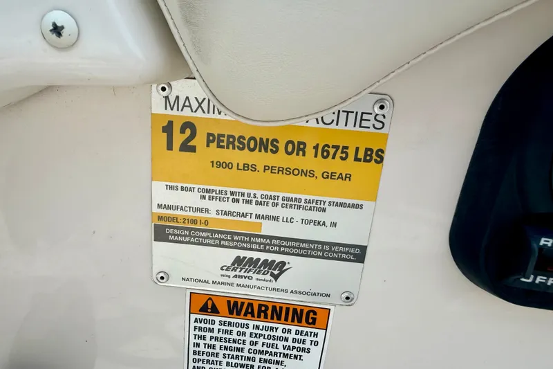 Slide: The Image of Capacity label on 2005 Starcraft 2100 IO RE Limited boat, max 12 persons or 1675 lbs. - 48