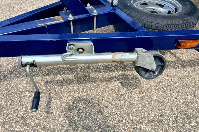 Slide: The Image of Trailer jack on a 2005 Starcraft 2100 IO RE Limited boat trailer. - 78