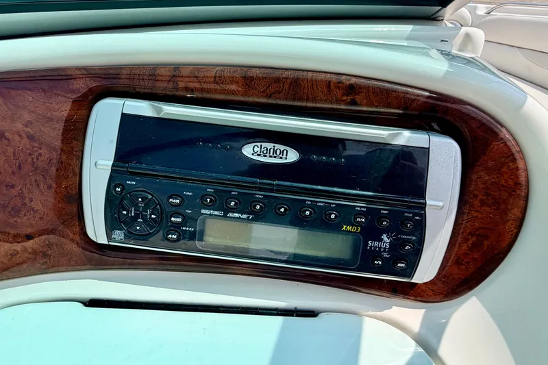Slide: The Image of Clarion stereo system in 2005 Starcraft 2100 IO RE Limited boat dashboard. - 55