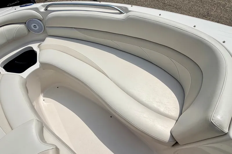 Slide: The Image of 2005 Starcraft 2100 IO RE Limited boat interior with white cushioned seating. - 63