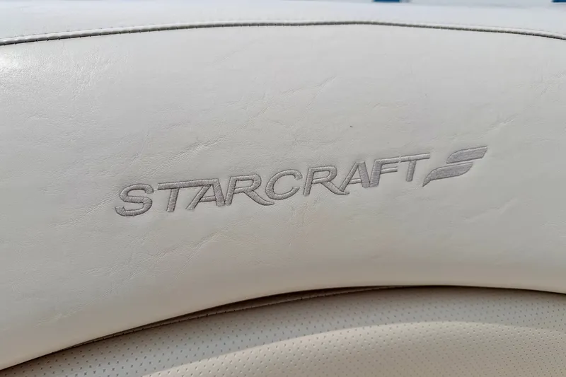 Slide: The Image of Embossed Starcraft logo on 2005 Starcraft 2100 IO RE Limited boat upholstery. - 32
